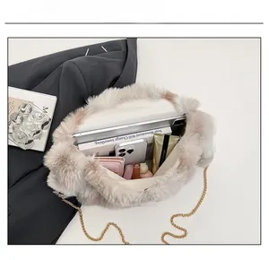 Interior view showing the large capacity of the fuzzy faux fur crossbody bag