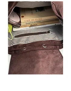 Brown faux suede backpack interior with striped lining and large capacity for books
