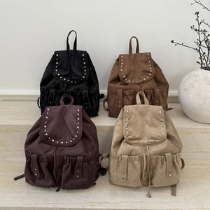 Retro vintage college backpack with flap and metal rivets in four earthy solid colors