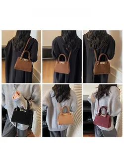 Detailed view of matte texture handbags in various colors featuring metal twist lock closure