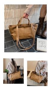 Detail of a brown leather tote bag with double vertical stitching and dual handles