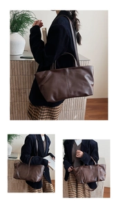 Detail of dark brown leather tote bag showing vertical stitching and large capacity