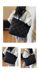 Detailed view of black quilted tote bag with large diamond stitching and soft texture