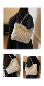Detail of large beige quilted tote bag with diamond pattern for daily commuting