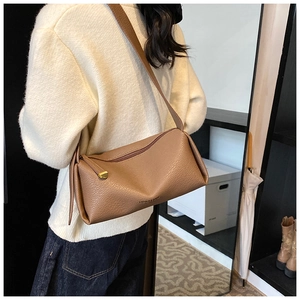 Brown lychee leather shoulder bag with FASHION & BAGS print shown in a lifestyle setting
