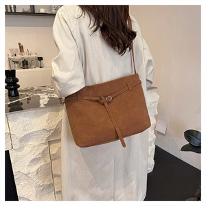 Brown matte suede tote bag styled with a beige trench coat for a chic autumn outfit