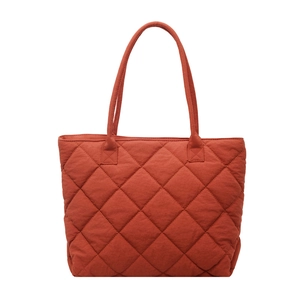 Brick red quilted tote bag with diamond stitching and minimalist commuter shoulder straps