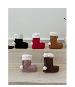 Detailed view of plush lamb wool Christmas stocking boots in five different seasonal colors