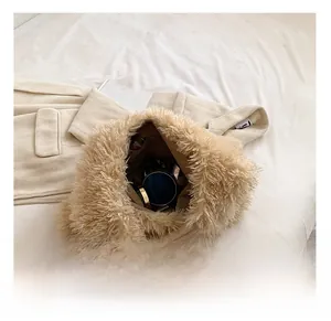 Interior view of beige faux fur handbag showing spacious storage for cosmetics
