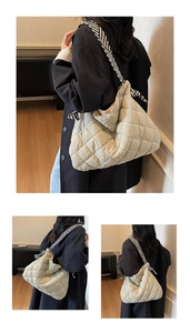 Close-up of quilted tote bag with diamond pattern and striped shoulder strap