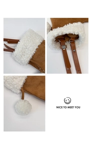 Detail of brown suede crossbody bag featuring white faux fur trim and adjustable strap