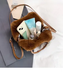 Detail view of the plush brown crossbody bag showing spacious interior for daily essentials