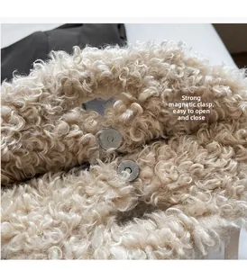 Close-up of the plush faux fur handbag featuring a strong silver magnetic buckle closure