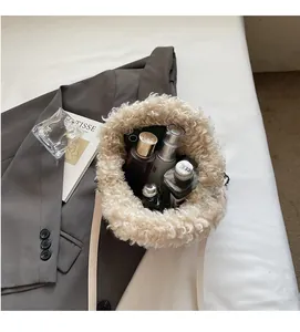 Top view showing the large capacity and interior space of this plush beige crossbody bucket bag