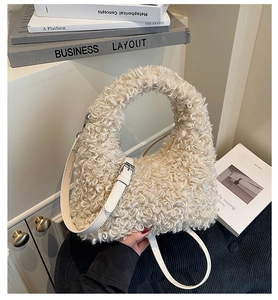 Detail of soft cream sherpa handbag with adjustable faux leather strap and furry handle
