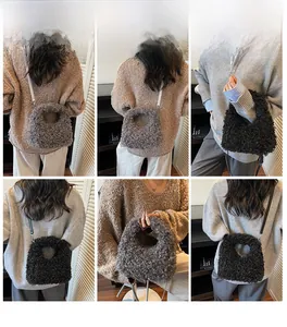 Faux fur handbag shown in crossbody and handheld styles on model with grey and black options