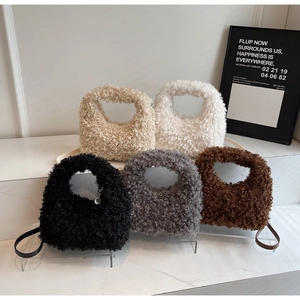 Detailed view of plush teddy faux fur handbags in five colors with leather straps