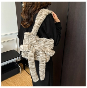 Detailed back view showing the plush animal print tote bag and large bow detail