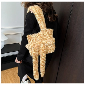 Detailed view of plush leopard print tote bag being worn with soft faux fur texture