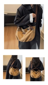 Detail of khaki canvas bag showing brown leather straps and metal ring accents