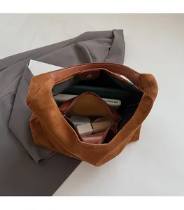 Top view of spacious leopard print suede tote bag with inner leather pocket and daily essentials