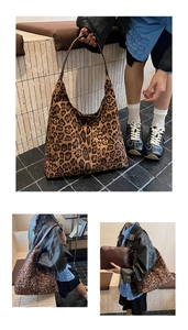 Detail of leopard print tote bag with brown leather handles and matching pouch