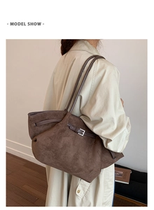 Brown frosted leather tote bag with silver buckle detail and long shoulder straps