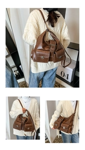 Detail view of vintage brown leather tote bag with flap pockets and silver buckles