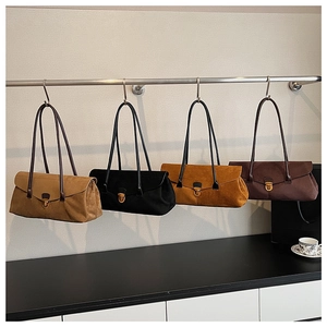 Row of retro matte leather shoulder bags in four colors with gold metal twist locks