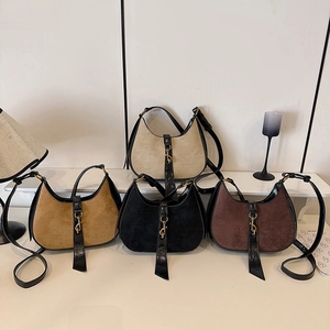 Minimalist crescent shoulder bags in suede and leather with vintage metal buckle