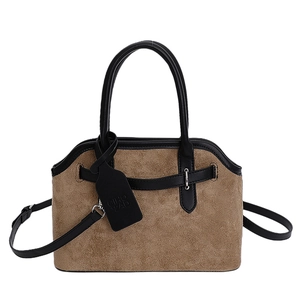 Minimalist brown suede tote bag with black leather handles and shoulder strap