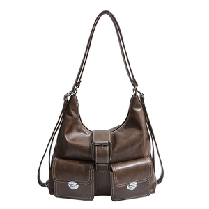 Deep brown retro faux leather tote bag with silver buckles on a plain white background