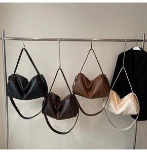 Minimalist soft leather crescent bags in black, dark brown, caramel, and beige colors