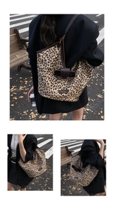 Outdoor street style view of leopard print tote bag with brown leather handles
