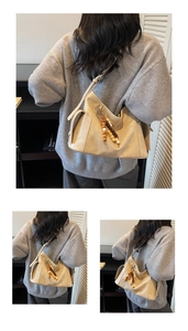 Detail of hobo handbag in soft beige PU leather with wooden bead tassel and side pocket