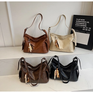 Detail view of large capacity vintage soft leather bucket bags in four classic colors