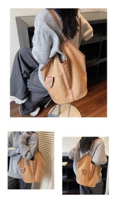 Detail of vintage matte suede tote bag showing large capacity and brown leather piping