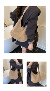 Detailed close-up showing the premium matte suede texture of the khaki shoulder bucket bag