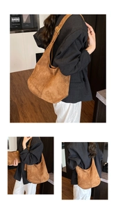 Detailed view of brown suede Hobo bag showing the adjustable strap and inner pouch
