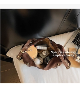 Top view of spacious brown suede tote bag showing large interior capacity with essentials