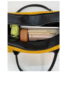 Detail showing the large interior capacity of this yellow suede tote bag for daily essentials