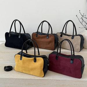 Vintage suede Boston handbags in five colors displayed on steps with leather straps