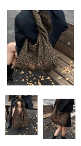 Close-up of leopard print tote bag with LCERIALIS embroidery and wide shoulder strap