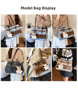 Detail of denim and leather tote bag featuring utility pockets and plush bear charm