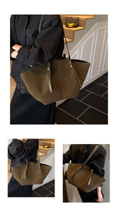 Vue détaillée du grand sac cabas en daim vert olive avec lanières en cuir sur modèle