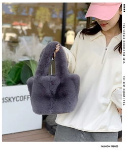 Detail of plush faux fur tote bag in deep purple with soft texture for autumn winter