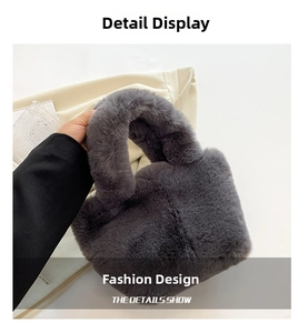 Detail of dark grey plush faux fur handbag featuring soft texture and sturdy handle
