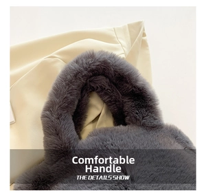 Close-up of soft faux fur texture and plush cylindrical handle on a gray bucket bag
