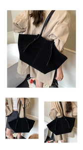 Détail du grand sac cabas noir mat avec design élégant de bandoulière à nœud souple