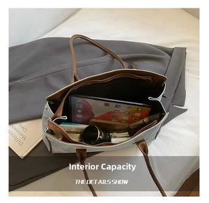 Spacious interior of retro tote bag showing tablet, notepad, and cosmetics organized well